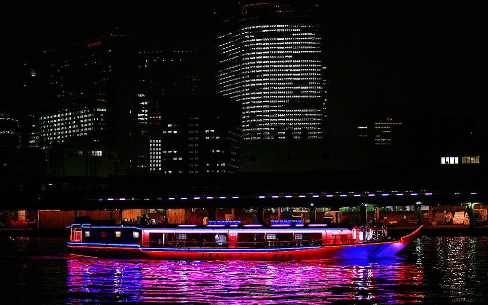 red and blue boat on lake during night time HD wallpaper